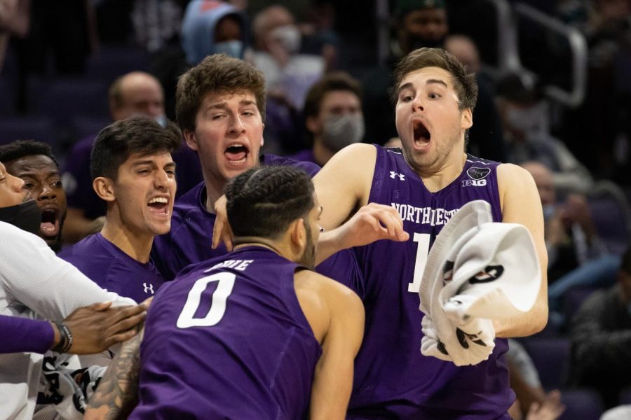Junior center Ryan Young and the Northwestern bench react to a Wildcat basket. NU trailed New Orleans at halftime and much of the second half, but rallied for an 83-67 victory.
