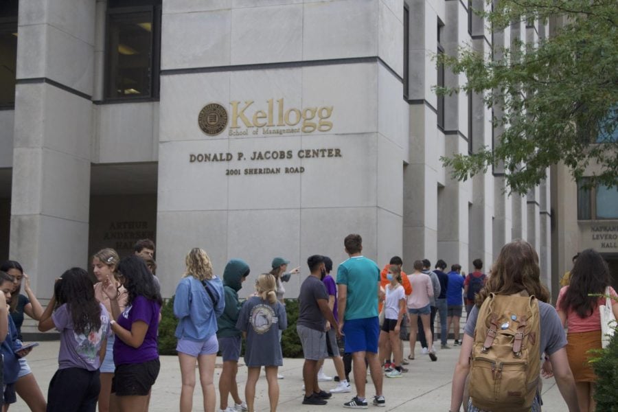 Students wait in line outside the Donald P. Jacobs Center.