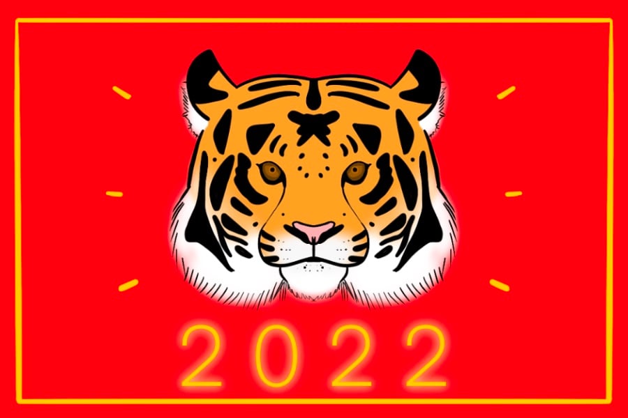 On a red background, there is a tiger’s face with “2022” written below it.