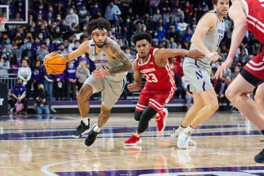 Boo Buie drives to the basket. Buie’s hot and cold streaks played a big role in Northwestern’s loss to No. 4 Purdue Sunday.