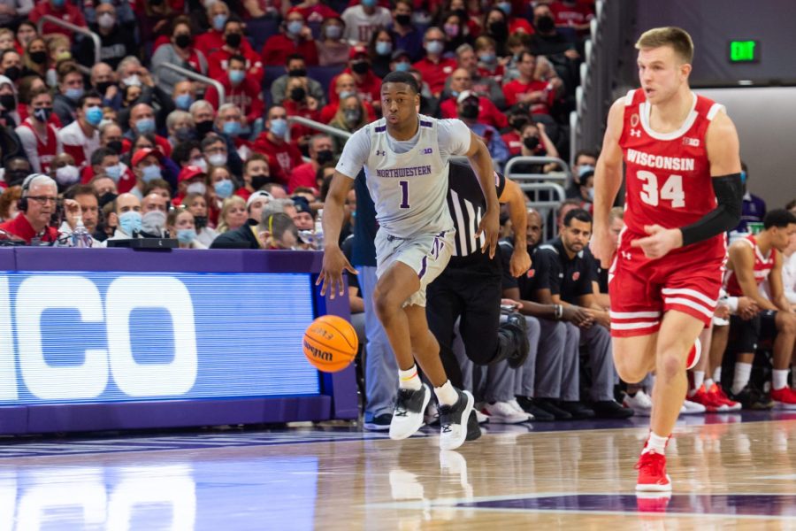Chase Audiges dribbles up the court. Audige had a team-high 23 points in Northwestern’s 82-76 loss to No. 8 Wisconsin.