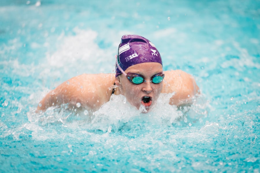 Swimmer in purple cap