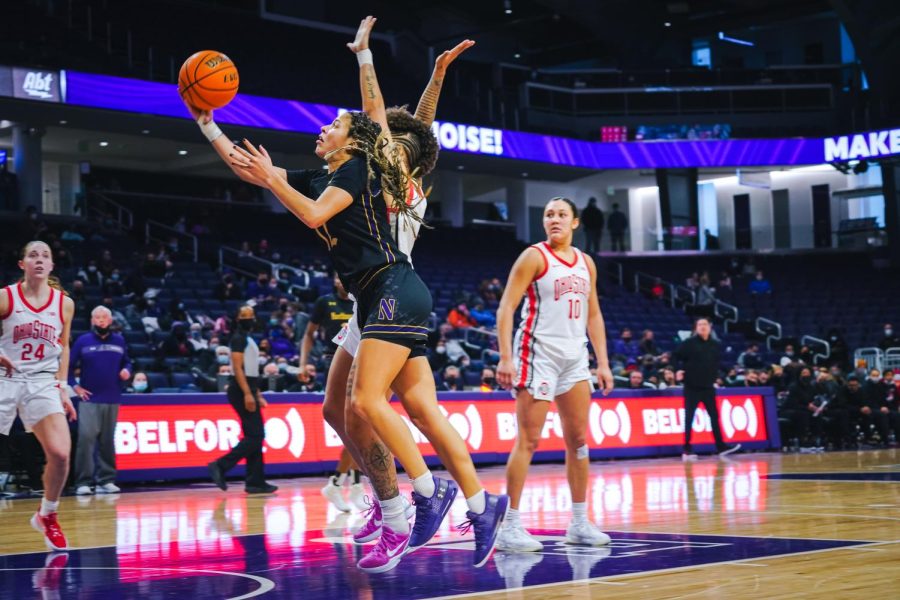 Northwestern senior guard Veronica Burton hits a layup inside the paint. Burton finished the night with 18 points against Rutgers.