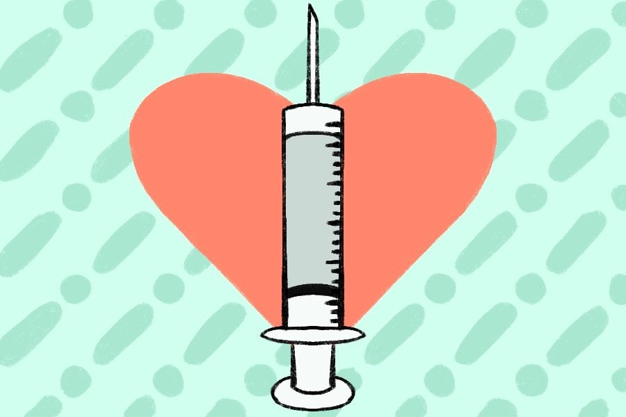A vaccine needle with a heart in the background. The heart is red and the photo background is a light green. D