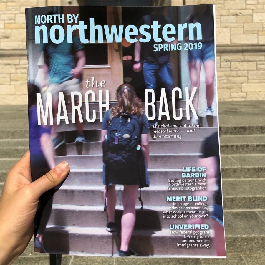 A hand holding a North By Northwestern Magazine