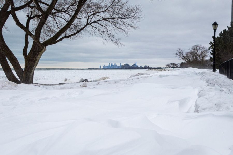The Chicago skyline sits behind an icy Lake Michigan.