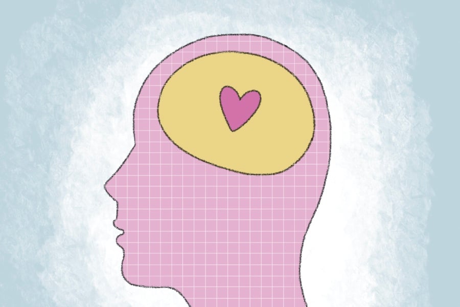 A silhouette of a pink head with a yellow brain and a pink heart on a blue background.