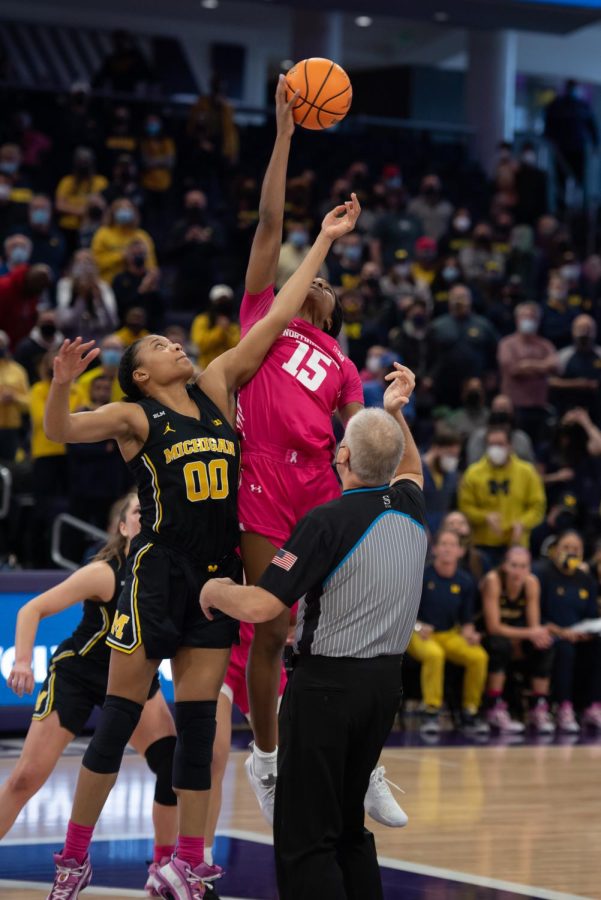 Senior forward Courtney Shaw jumps for the ball at tip-off against Michigan. Shaw held her own in the backcourt against Indiana with 10 rebounds.