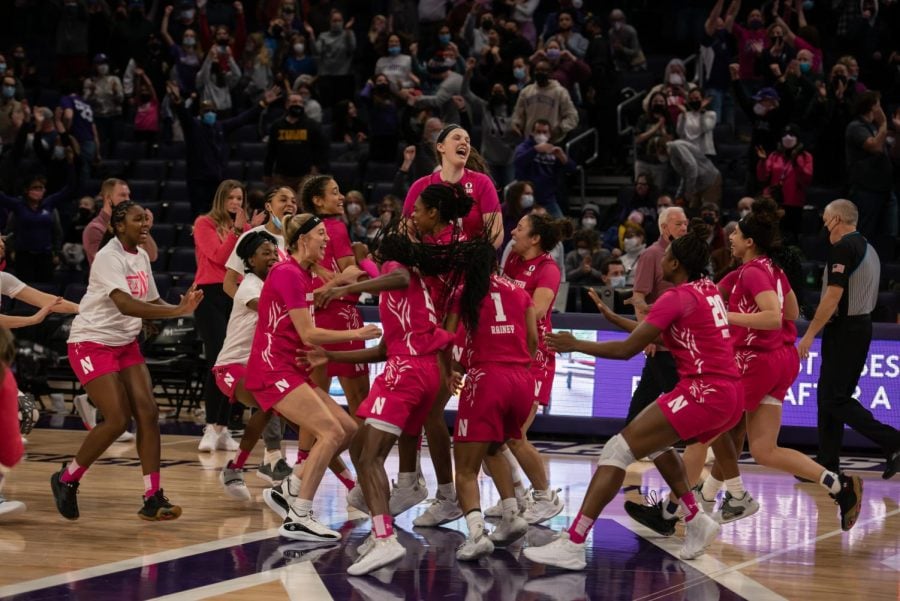 Basketball players celebrate win