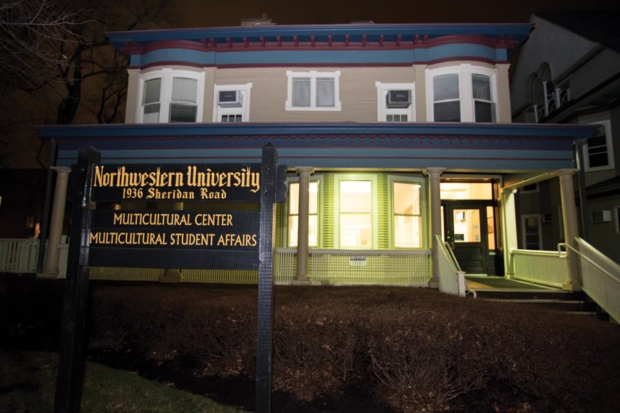 A house with a sign in front that reads “Multicultural Center. Multicultural Student Affairs.”