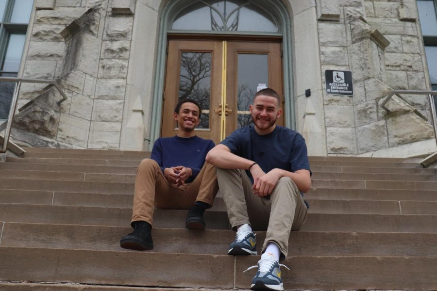 Jason Hegelmeyer (left) and Donovan Cusick (right) sitting on the stairs of University Hall.