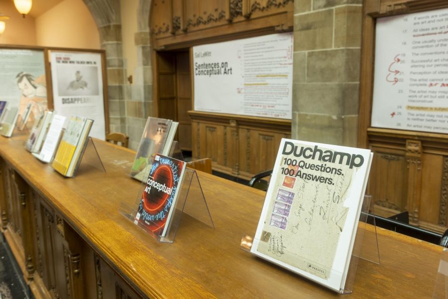 A bookshelf in Deering Library is covered with books about conceptual art.