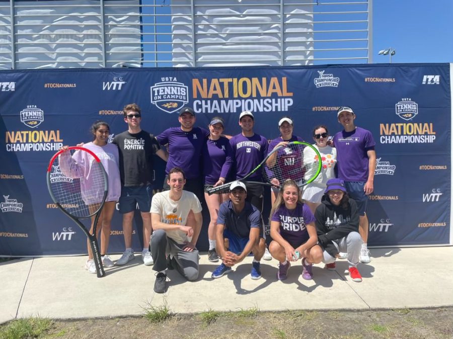 Group+of+people+in+purple+clothes+smiling+with+tennis+rackets