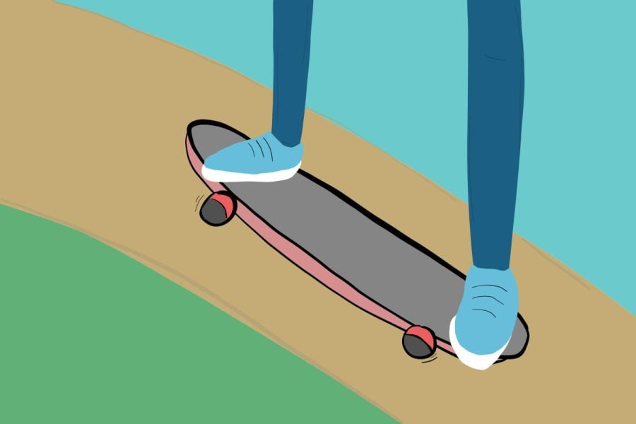 A skateboarder’s legs in jeans and blue sneakers roll down a road.