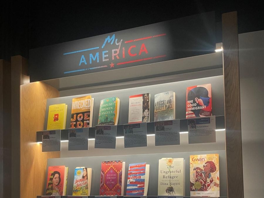 A book gallery titled “My America,” featuring a series of immigrant and refugee books.