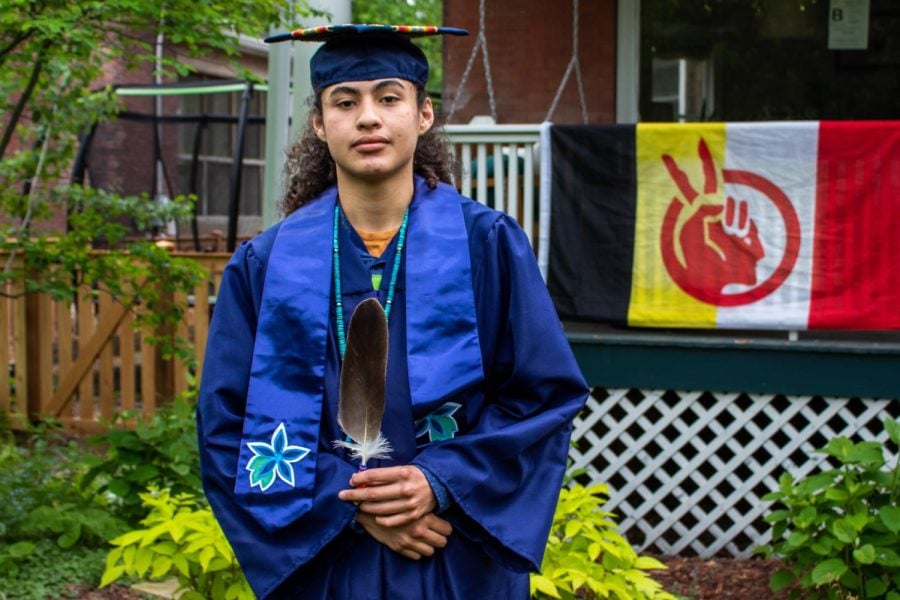 Recent ETHS graduate Nimkii Curley did not walk at graduation this Sunday after he was pulled out of line for adorning his cap and gown with an eagle feather and traditional Ojibwe floral beadwork. 