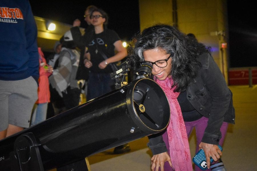 Community members gathered atop the South Campus Parking Garage Sunday night to view the total lunar eclipse which turned the moon red.