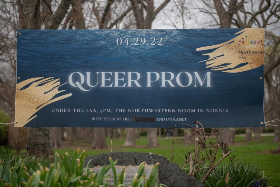 NU’s Queer Prom! advertising banner just past the arch.