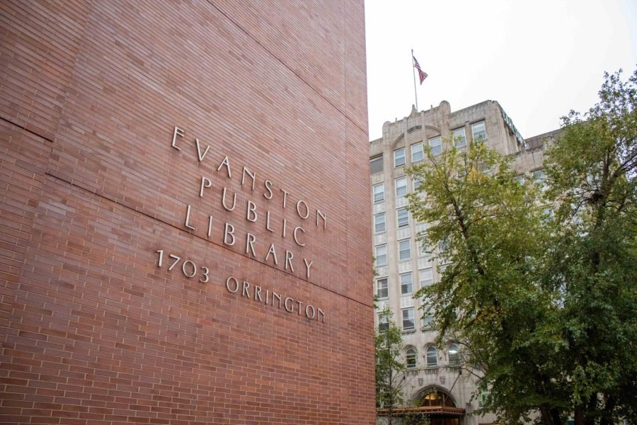 A red brick building with “Evanston Public Library” written on it in silver script.