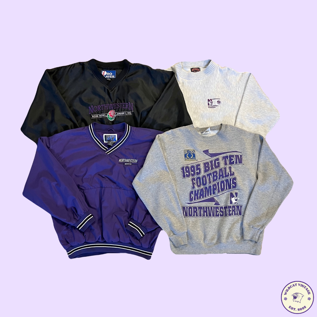 Four+pieces+of+clothing%2C+including+two+gray+crewnecks+and+one+black+and+one+purple+windbreaker%2C+against+a+light+purple+background.