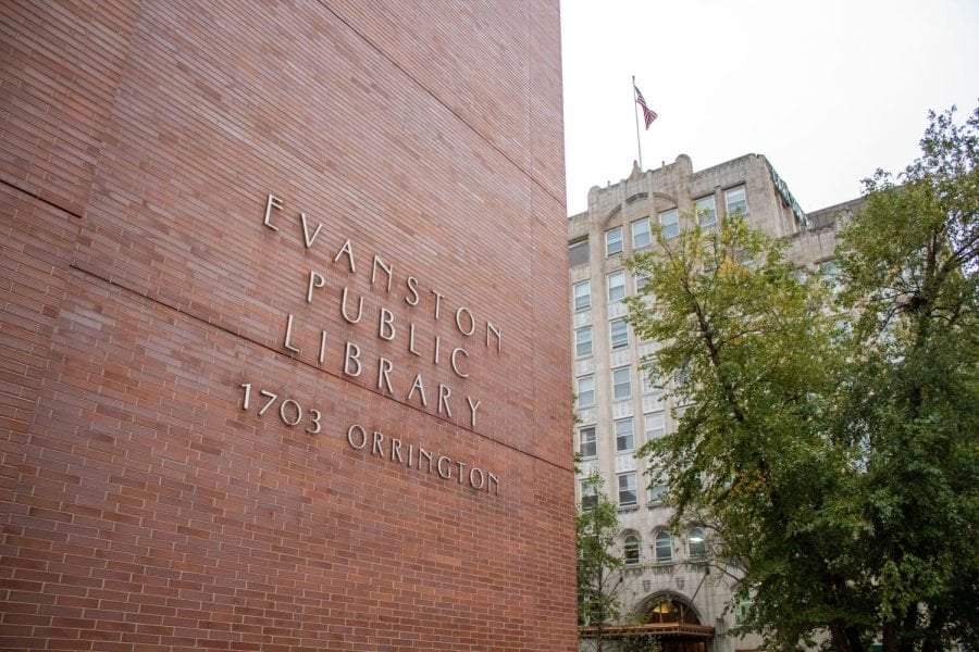 Front of tall red-brick building with the words “Evanston Public Library 1703 Orrington” in steel letters.