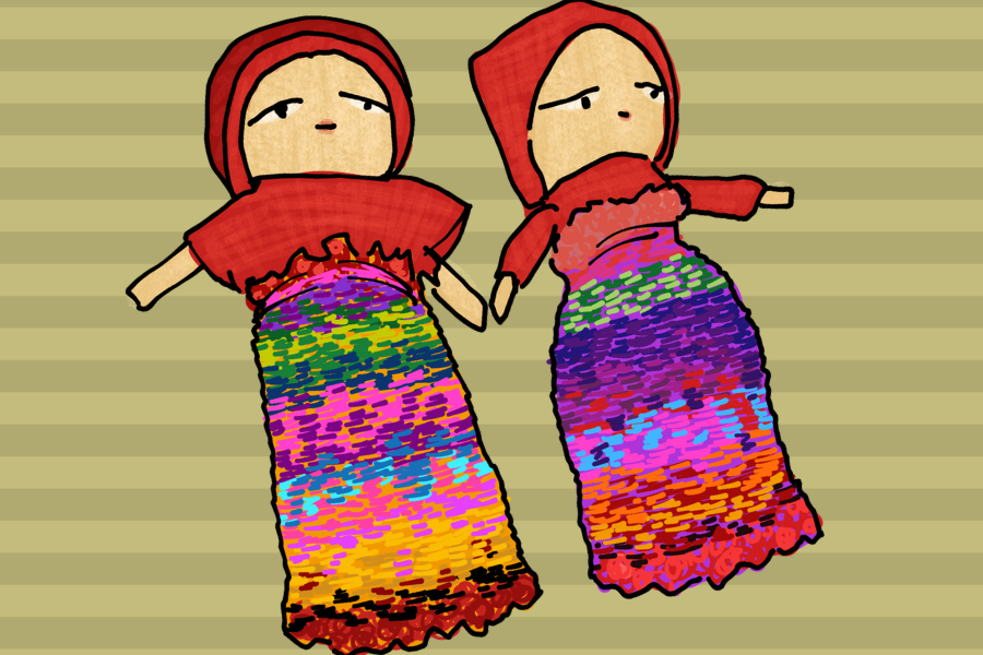 Two Guatemalan “worry dolls,” complete with multicolored dresses and red blouses, on a gold-striped background.