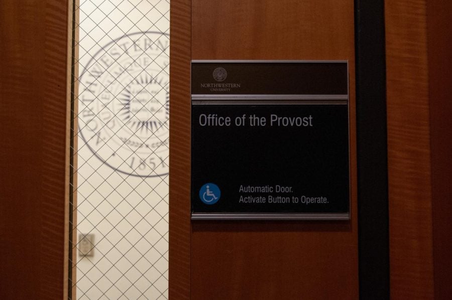 Black sign on office door that says, “Office of the Provost.”