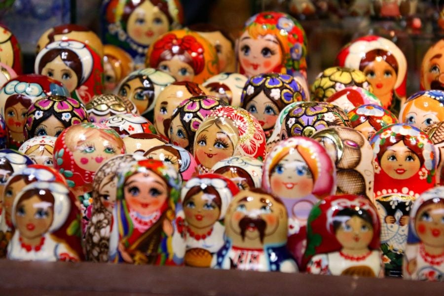 Several multicolored dolls on display.