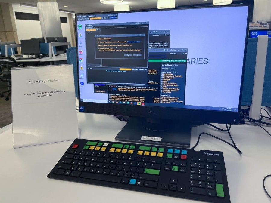 A computer in a library with Bloomberg introductions on the screen.