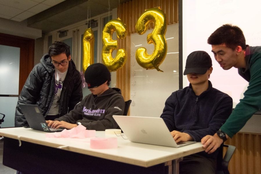 Students competed in a typing contest, requiring contestants to cover their eyes during the BadHacks event Saturday.
