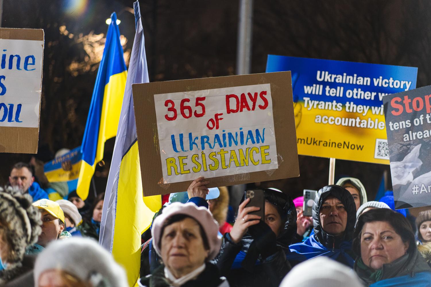 Protesters+are+holding+posters.+The+central+sign+says%3A+%E2%80%9C365+days+of+Ukrainian+Resistance%2C%E2%80%9D+written+with+blue+and+yellow+colors+of+the+Ukrainian+flag.