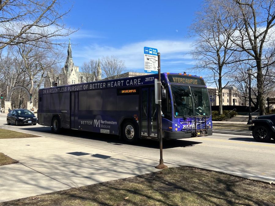 Purple campus shuttle with Northwestern Medicine theme.