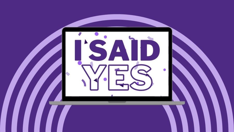 A computer screen on a purple background shows purple confetti and the words “I said yes!” filling the screen.