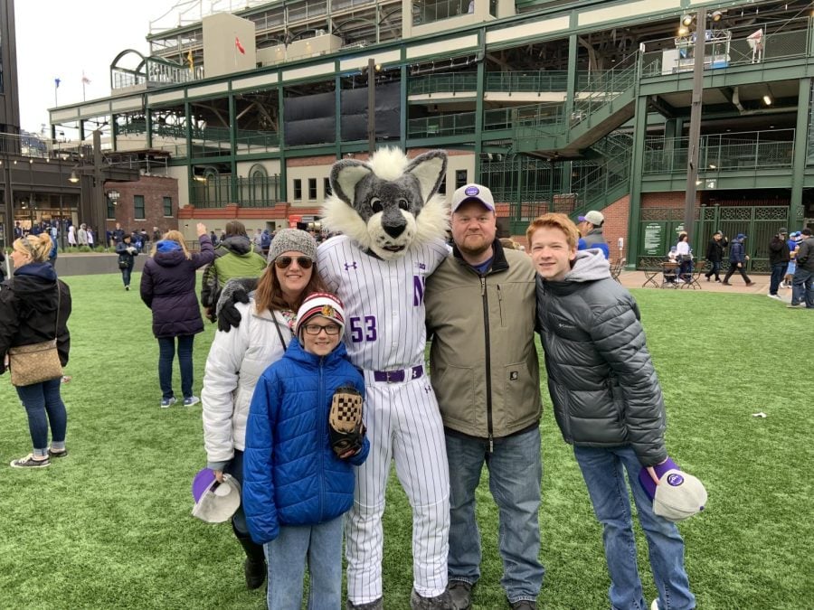 Kevin+McLean+and+his+family+pose+with+Willie+the+Wildcat+on+green+grass+in+front+of+Wrigley+Field.