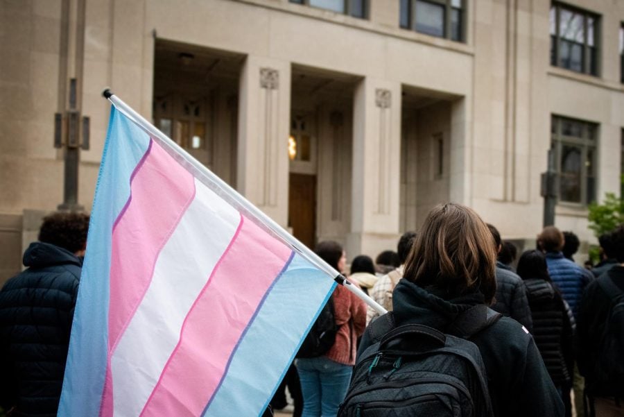 A protester in the crowd outside Swift Hall held the transgender pride flag. 