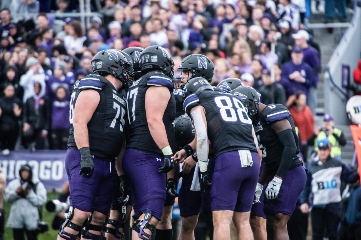 A team huddle. A former player alleges that inappropriate hazing traditions took place throughout his time at NU. 