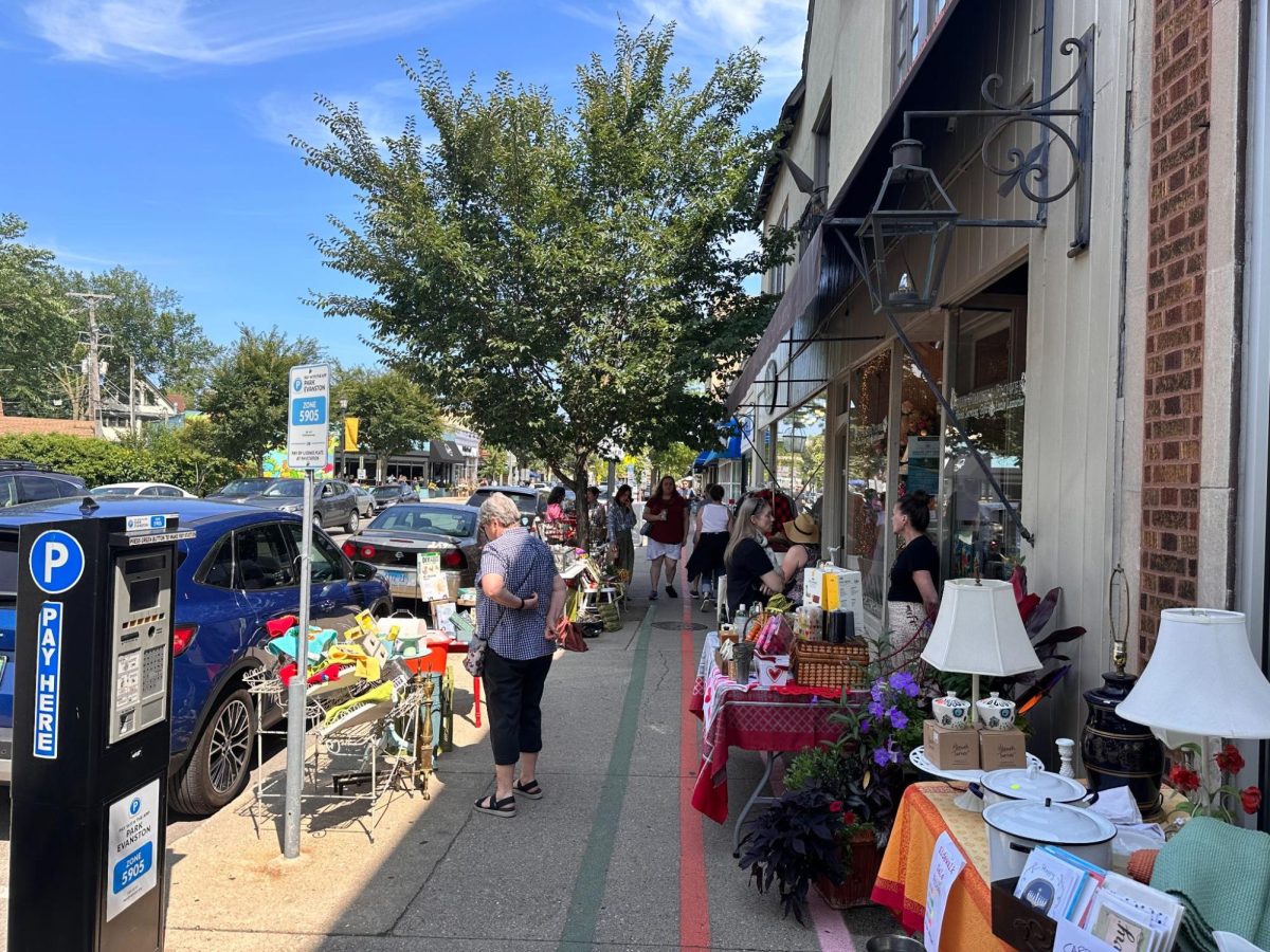 Customers browsed through the Sidewalk Sale items and interacted with local store owners.