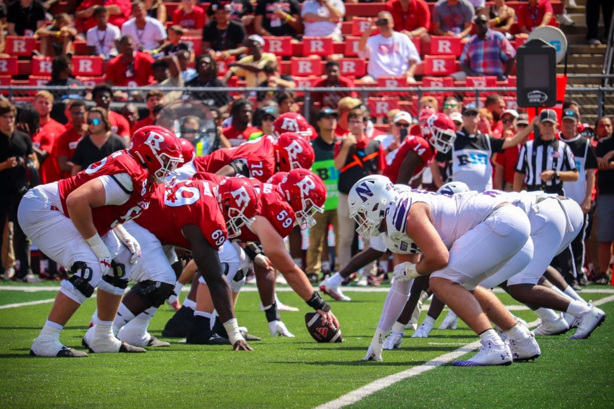 Northwestern’s defensive line gets set prior to a snap in Sunday’s defeat to Rutgers. To be successful in its home opener, the Cats’ defense will need to prioritize stopping the running game.