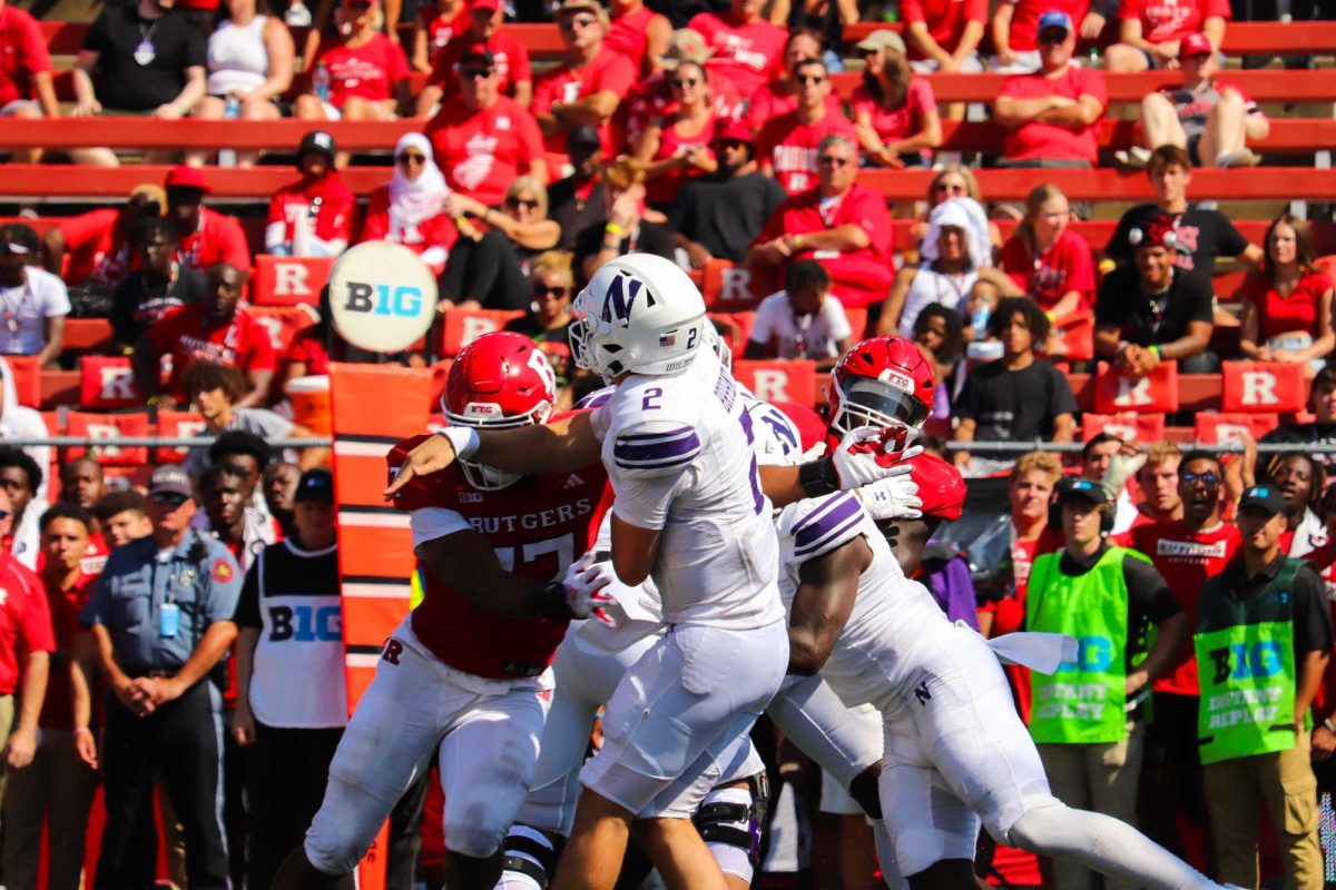 Graduate student quarterback Ben Bryant gets hit in the pocket. In his Northwestern debut, Bryant completed 20-of-35 passes for 169 yards and two interceptions in the Wildcats’ 24-7 loss to Rutgers.