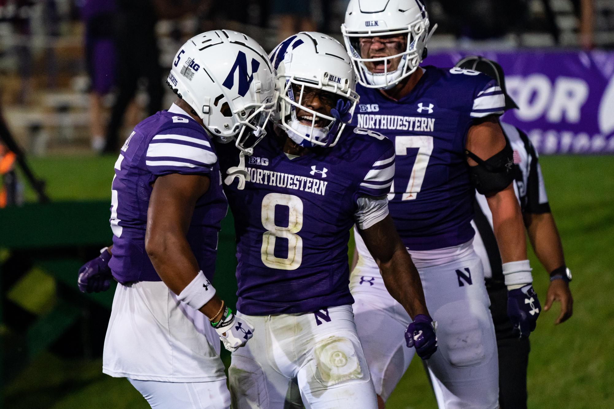 A.J. Henning celebrates with his teammates after a big play. NU’s comeback victory over Minnesota showed its ability to fight back, regardless of the situation and circumstances.