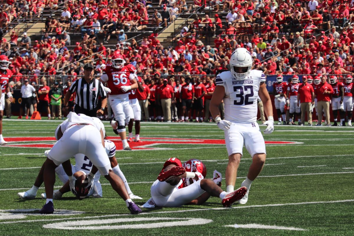 Senior linebacker Bryce Gallagher and other Northwestern defensive players after a play. Gallagher was one of three players that had an interception in Saturday’s win versus UTEP. 