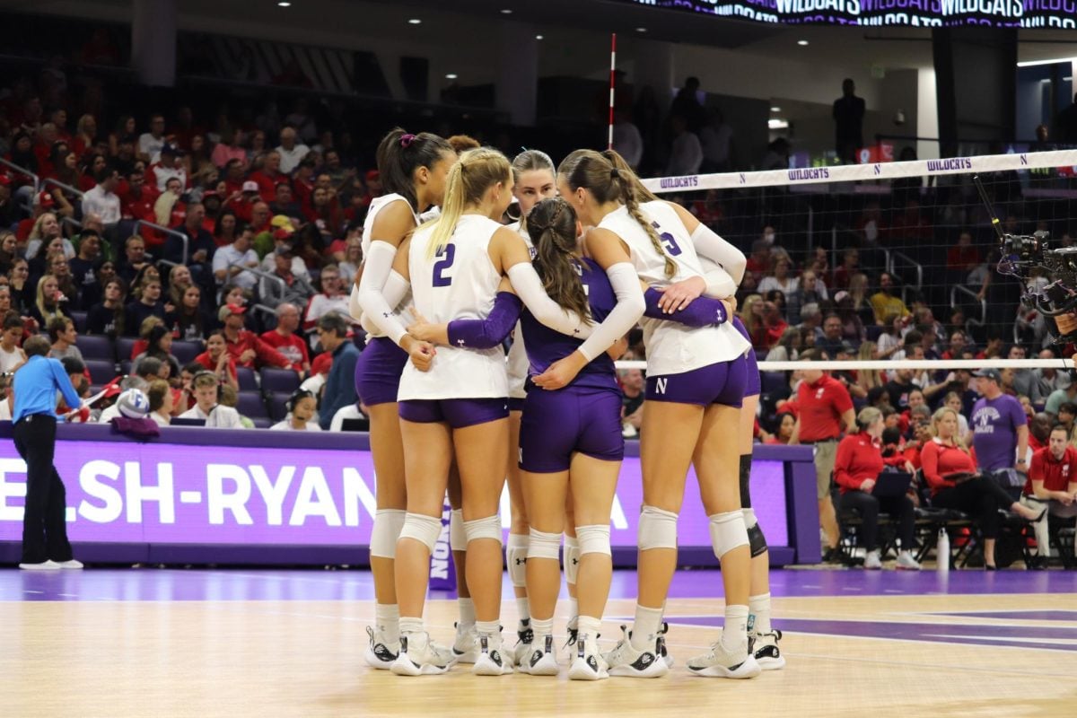 Northwestern volleyball huddles during Friday’s match against Wisconsin. 