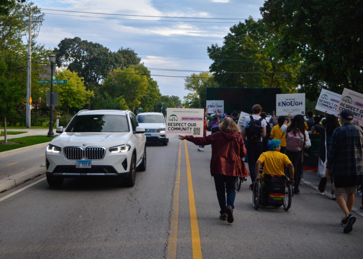 Protestors opposing the new Ryan Field marched down half of Sheridan Road toward the Lorraine H. Morton Civic Center. They began at Lighthouse Beach and were accompanied by a car caravan.