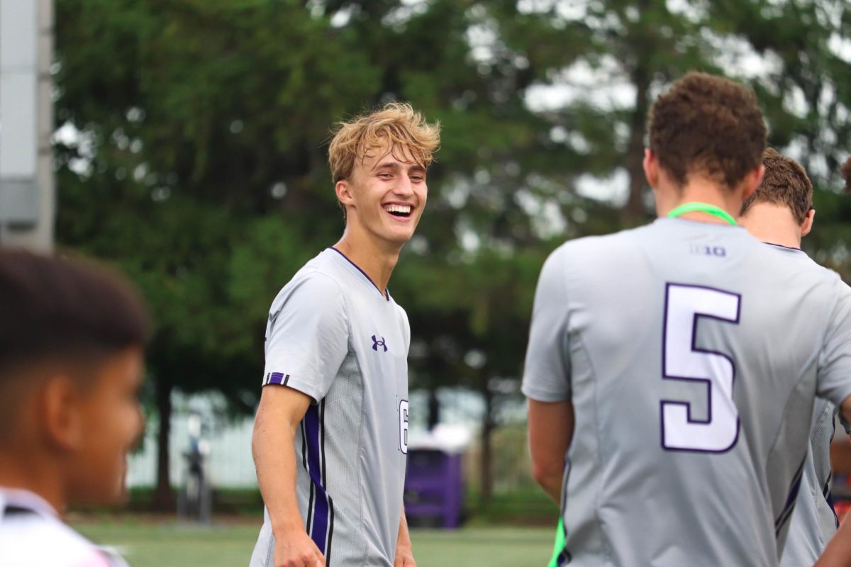 Freshman defender Bryant Mayer smiles at his brother Reese Mayer after No. 13 Northwestern beat Ohio State on Sunday.
