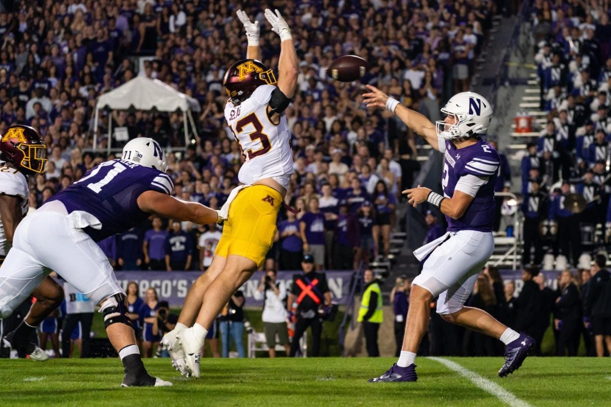 Graduate student quarterback Ben Bryant throws a pass against Minnesota. Bryant’s status for Saturday’s game against Howard remains unclear.