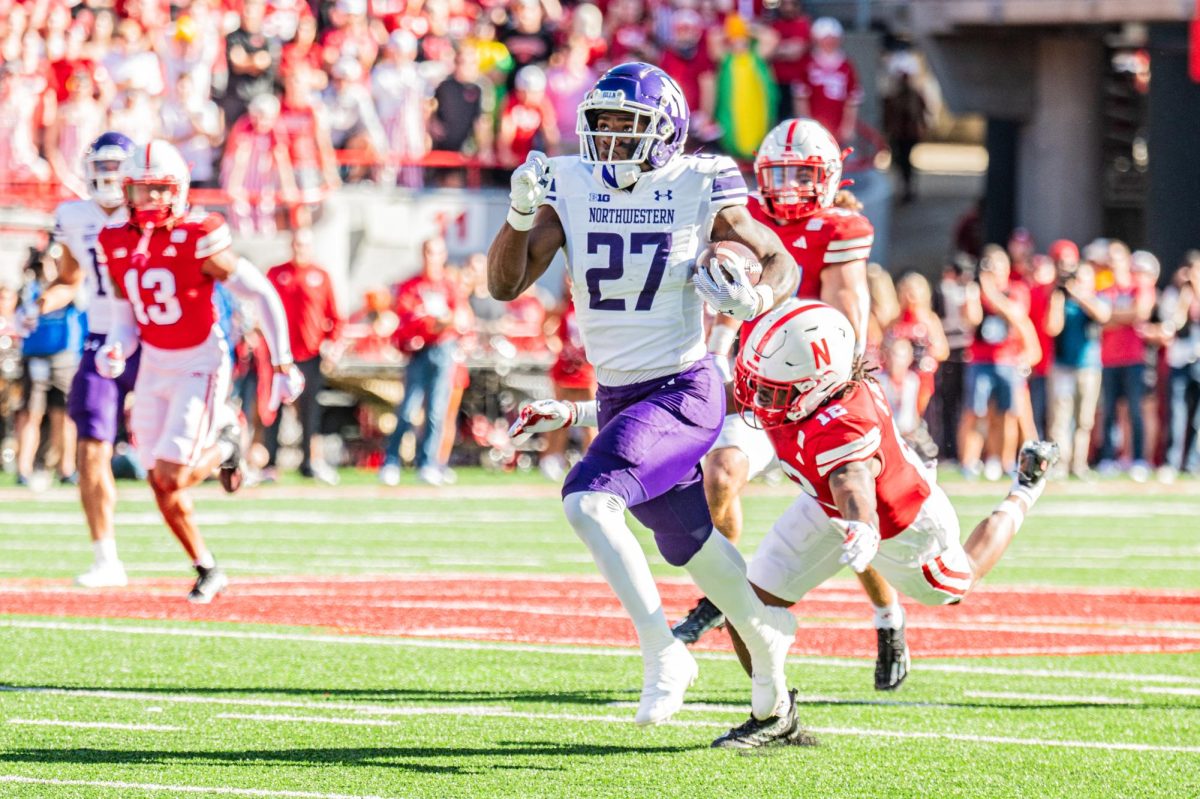 Junior running back Anthony Tyus III breaks away for a 39-yard run. He led the ‘Cats in rushing yards on Saturday. 