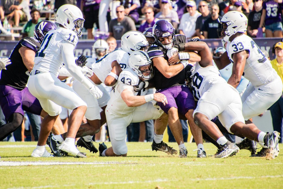 Sophomore quarterback Jack Lausch is tackled. Northwestern fell victim to a 31-point second-half burst from No. 6 Penn State on Saturday in a 41-13 defeat.