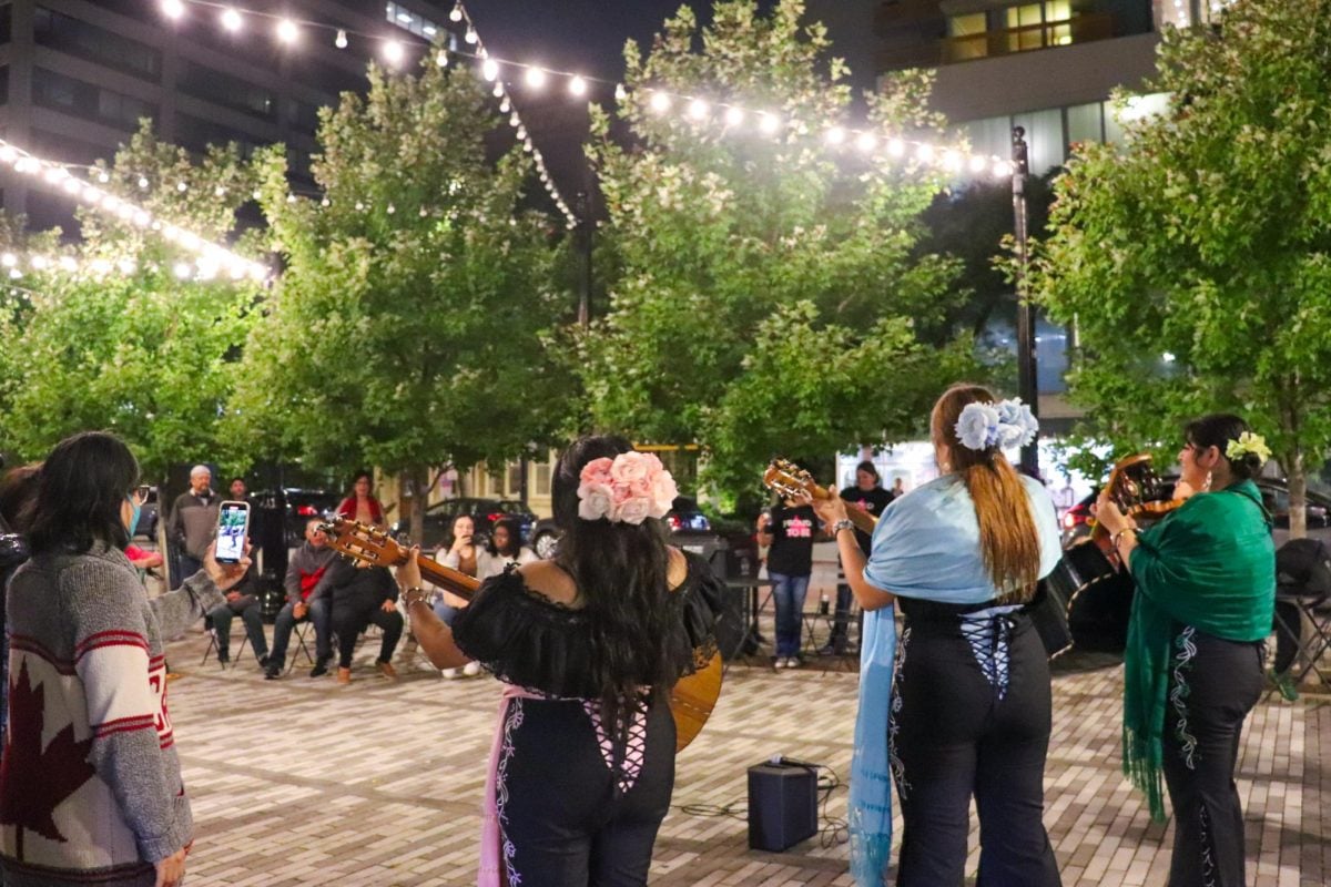 Fiesta Hispana attendees watch Mariachis Sirenas perform at Fountain Square. The all-women mariachi group was one of many attractions at the third annual event.