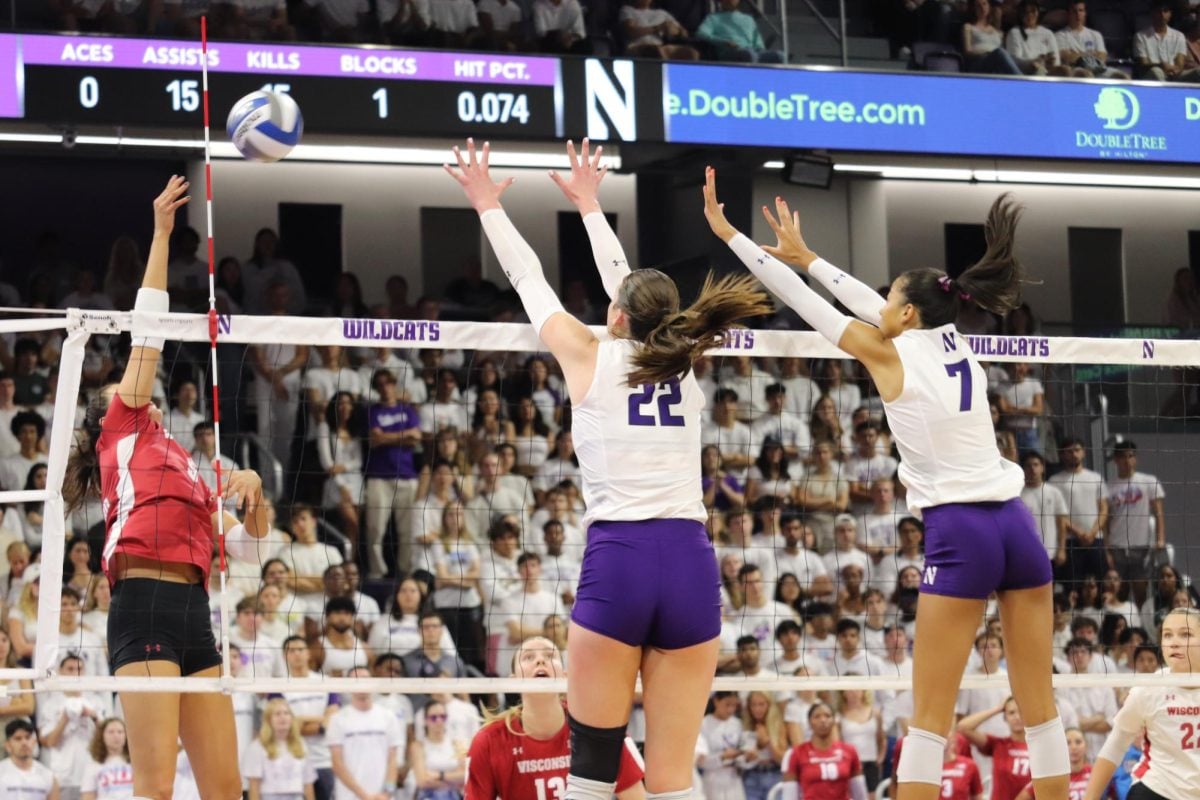 Northwestern graduate student outside hitter Julia Sangiacomo and senior middle blocker Leilani Dodson jumping to block the ball in a match earlier this season. Sangiacomo recorded a career-high 33 kills on Sunday.
