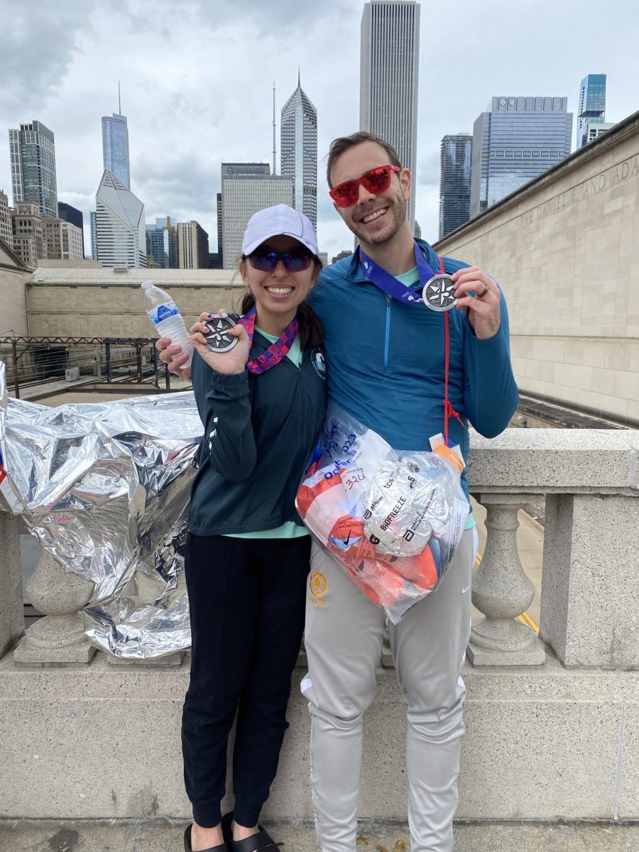 Allison Naval (left) stands with husband David Russell (right) after finishing the Chicago Marathon on Oct. 8. She is the one millionth runner in the marathon’s history to finish the race. 